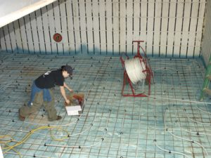 RFH Technician Laying Floor Heating Pipe